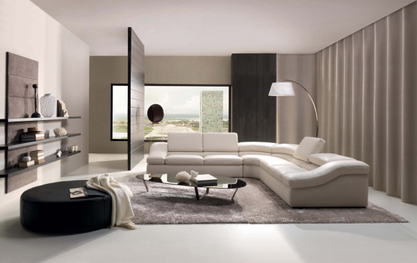 Interior,Minimalist Interior Designer Living Room Decoration With Modern White Leather Sectional Sofa And Cool Black Glass Oval Shaped Table On Combined Soft Gray Rug Plus Picturesque White Drum Arc Floor Lamp Also Exquisite Black Ottoman,The Best High Quality And Cheap Interior Designer Living Rooms