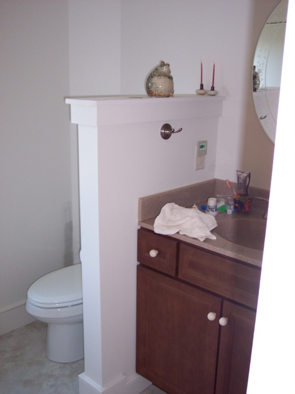 Apartments,Fancy Bathroom Design For Apartement With Beautiful Rown Vanity And Wonderful White Closet Seat Also Gorgeous Iron Hook In White Wall,Gorgeous Small Space Bathroom Designs For Apartments
