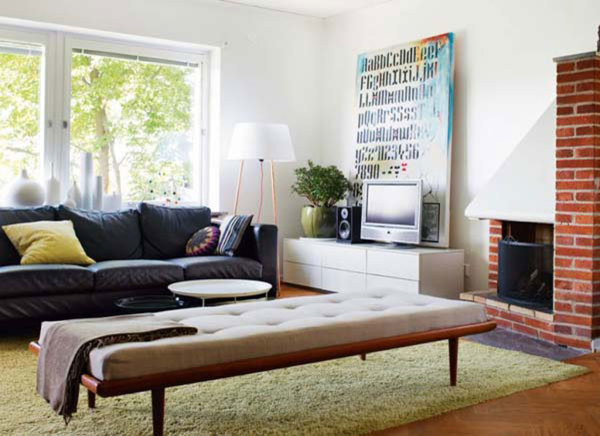 Apartments,Dazzling White Wall Paint Studio Apartment Interior Design Ideas With Marvelous Black Leather Three Seater Sofa Plus Comfortable Large White Ottoman And Nice Green Fur Rug On Combined Trendy Brown Tile Floor Also Modern Entertainment Tv,Extraordinary Studio Apartment Interior Designs