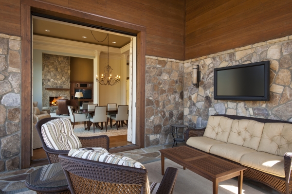 Exterior,Fascinating Stone Mixed Brown Wood Wall Panel Indoor Outdoor Living Space Design Ideas With Beautiful Tv Wall Unit And Comfortable Brown Wicker Sofa And Nice Single Seater Sofas Also Cool Brown Wood Table Plus Soft White Rug,Indoor Outdoor Living Spaces
