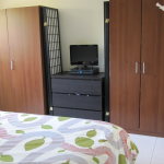 Bedroom,Adorable Cream Wall Paint Ikea Bedroom Closet Design With Amazing Double Brown Wood Closet And Nice Black Entertaiment Center Also Modern White Ceramic Tile Floor,Trendy Furniture Ikea Bedroom Closets