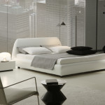 Bedroom,The Best Beautiful Neutral Bedroom Ideas With Charming White Bed Frame On Combined Comfortable White Bed Sheet And Unique Blakc Cup Arc Floor Lamp Also Cool Iron Chair Plus Soft Round White Rug Using Trendy White Wood Linen Floor For Modern Concept,Comfortable Neutral Bedroom Ideas To You