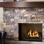 Interior,Fascinating Cream Background Stone Fire Places Design With Beautiful Traditional Stacked Stone Fireplace And Cool Dark Brown Walnut Wood Wall Mount Shelf Also Comfortable Black Leather Sofa Plus Gorgeous Floor Candle Stand,The Beauty Of Stone Fire Places Your Home Inspiration