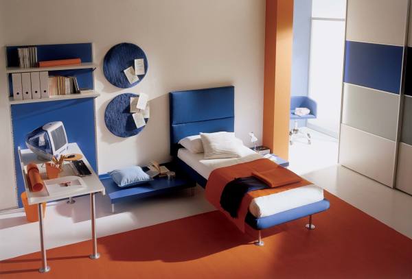 Bedroom,Modern Large Space Children Bedroom Design Ideas With Stylish Blue Bed Frame On Combined Soft White Bed Sheet And Exquisite White Flat Study Table Plus Cool Wall Hanging Book Shelves Also Splendid Large Brown Carpet Color,Cool Stylish With Themed Children Bedroom Designs