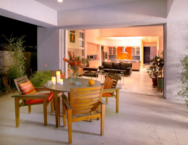 Exterior,Contemporary White Wall Paint Indoor Outdoor Living Space Design Inspiration With Charming Open Plan Living Room And Wonderful Bright Wood Round Table Plus Beautiful Glass Potted Plant Also Gorgeous Bright Wood Chairs,Indoor Outdoor Living Spaces