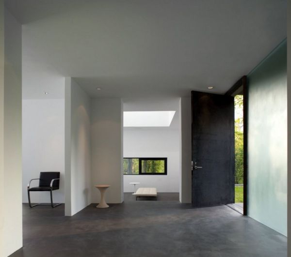 Interior,Exquisite White Wall Paint Interior Design Ideas With Charming White Lounge Chair Plus Nice Gray Floor And Modern Black Chair Also Wonderful Black Wood Door,Minimalist Interior Designers