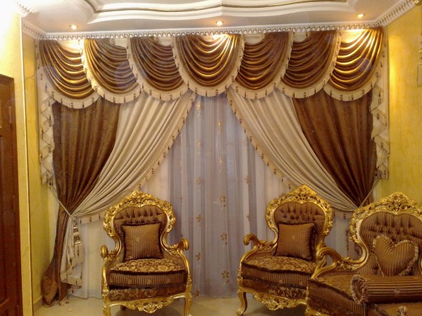 Interior,Adorable Yellow Wall Paint Window Curtain Design Ideas With Stunning Brown And Cream Curtains Plus Nice Large White Transparent Also Comfortable Brown Gold Single Seater Sofa For Elegant Concept,Window Curtain Design Ideas Looks Beautiful In The House