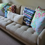Furniture,Impressive Decorative Pillows For Couche With Fabulous White Fabric Two Seater Sofa And Nice Black Wood Round Accent Table Also Gorgeous White Wall Paint,Cute And Pretty Decorative Pillows For Couches