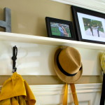 Interior,Pretty Coat Hanger Design Inspiration With Charming Coat Rack Storage Bench In Beautiful White Wood Material And Cool Three Black Iron Hook Also Splendid Black Picture Frames,The Best High Quality And Unique Coat Hangers