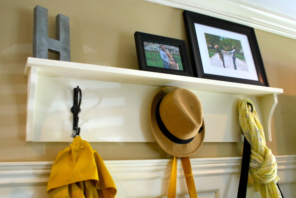 Interior,Pretty Coat Hanger Design Inspiration With Charming Coat Rack Storage Bench In Beautiful White Wood Material And Cool Three Black Iron Hook Also Splendid Black Picture Frames,The Best High Quality And Unique Coat Hangers