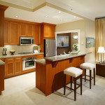 Furniture,Extraordinary Interior Design Picture With Stylish Cherry Wood Kitchen Cabinet And Beautiful Oven Stove Built In Craft Plus Comfortable White Bar Stools Also Wonderful Cream Wall Paint,Pretentious Interior Design Pictures 2015