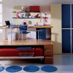 Bedroom,Exquisite White Background Children Bedroom Design With Amazing Trundle Bed On Combined Comfortable Red Bed Sheet And Cool Brown Wood Desk Plus Beautiful Blue Chair Also Stylish Large Blue Cream Wardrobe,Cool Stylish With Themed Children Bedroom Designs