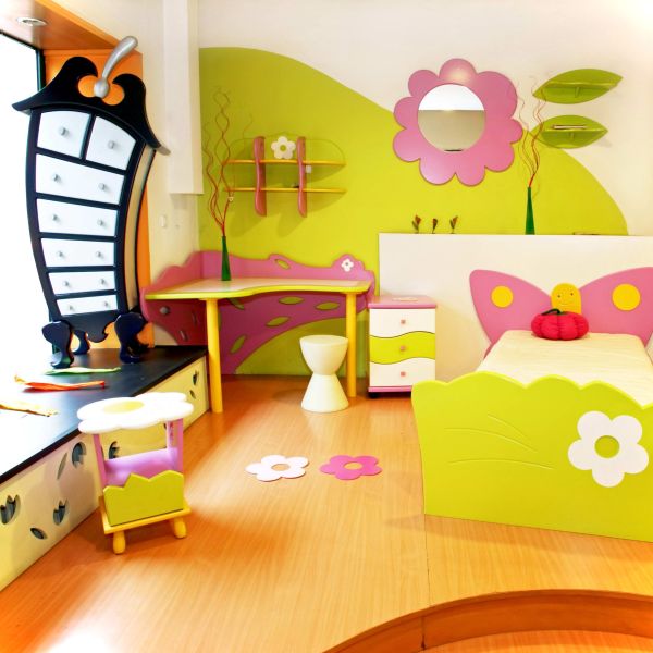 Bedroom,Creative Wall Decal Children Bedroom Design Ideas With Cute Bed And Nice White Yellow Curved Corner Study Table Plus Unique White Chair Also Gorgeous Brown Laminate Flooring,Cool Stylish With Themed Children Bedroom Designs