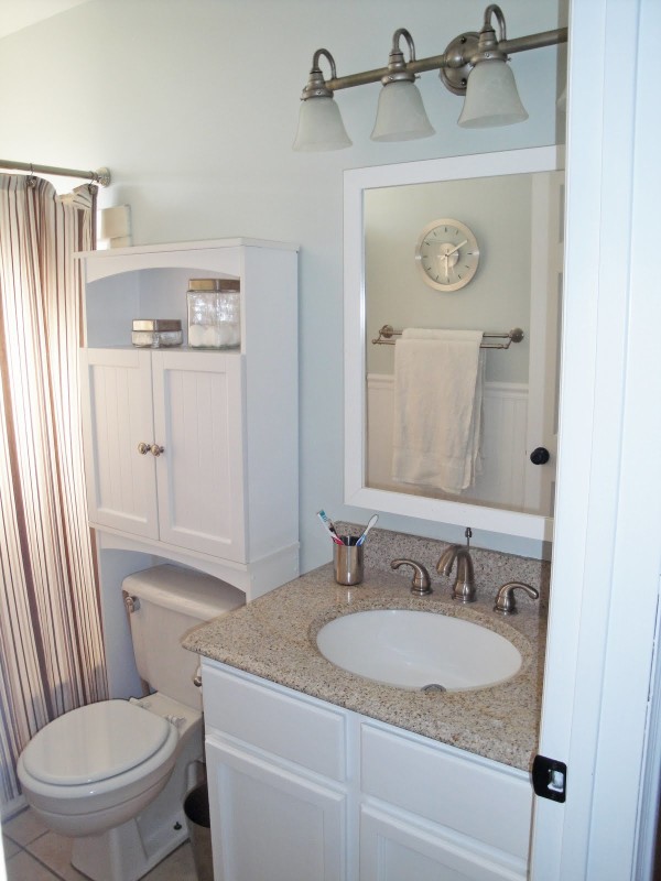 Bathroom,Marvelous Light Blue Wall Paint Bathroom Storage Ideas For Small Bathroom With Beautiful White Wood Bathroom Vanity On Combined Nice Cream Granite Countertop And Gorgeous White Wood Wall Mirror Frame Also Modern White Ceramic Toilet Plus Wonderful Three Wall Mount Bathroom Lighting,Cool Neat Bathroom Storage Ideas For Small Bathrooms