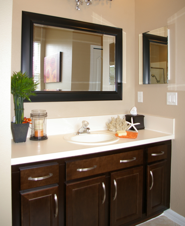 Apartments,Exquisite Bathroom Design For Apartement With Charming White Ceramic Countertop On Combined Single Sink And Beautiful Brown Wood Vanity Cabinet Also Cool Rectangular Glass Mirror Plus Black Frame ,Gorgeous Small Space Bathroom Designs For Apartments