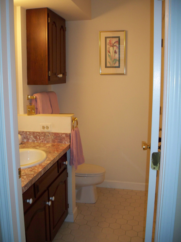 Apartments,Impressive Small Bathroom For Apartement With Cool Brown Floating Wood Cabinet And Beautiful White Granite Top On Combined Sink Also Comfortable White Ceramic Closet Seat ,Gorgeous Small Space Bathroom Designs For Apartments