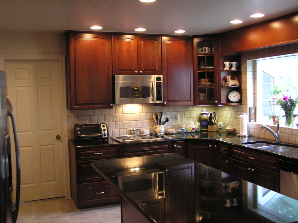 Interior,Enthralling White Ceiling Small Luxury Kitchen Decoration With Stunning Black Wood Kitchen Cabinet On Combined Nice Black Marble Countertop And Wonderful Brown Wood Floating Kitchen Cabinet Also Gorgeous White Subway Tile Backspash,Best Small Luxury Kitchens Inspiration