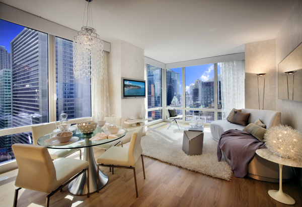 Apartments,Impressive White Manhattan Penthouse Apartement Design Ideas With Comfortable Beige Lounge Sofa On Combined White Fur Rug And Cool Tv Wall Units Also Cool Awesome Round Glass Dining Table Plus Beautiful Crystal Pendant Lamp For Living Room,Manhattan Penthouse Apartments