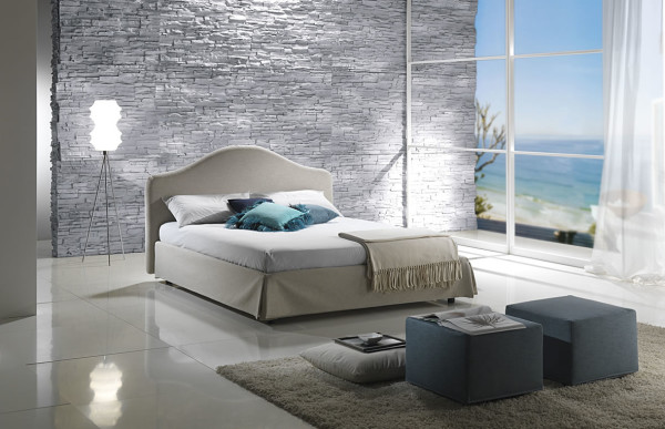 Bedroom,Charming Italian Themed Modern Bedroom Design Inspiration With Nice Stone Wall And Comfortable Low Profile Bed On Combined Oval Headboard Also Soft Two Blue Ottoman,Modern Bedroom Design