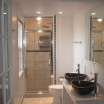 Bathroom,Impressive Small Space Wall Light Design Inspiration With Unique Black Bowl Double Sink In Nice Black Ceramic Material And Amazing Chrome Double Bathroom Faucet Plus Wonderful Great Square Wall Mirror Also Cool Stainless Steel Handle Sliding Glass Door In Modern Steam Shower,Classic Wall Lights Inside Bathroom