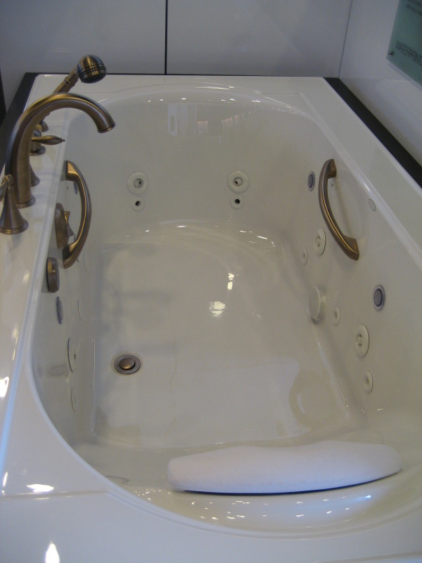 Bathroom,Splendid Overflow Bathtub Design Inspiration With Beautiful Corner Bathtub In Wonderful Black White Color And Cool Oil Rubbed Bronze Bathroom Faucet,Contemporary Overflowing Bathtubs 