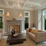 Interior,Admirable Gray Wall Paint Indoor Stone Fireplace Design Inspiration With Stylish Bright Brown Leather Sofas And Gorgeous Dark Brown Wood Coffe Table On Combined Soft Cream Area Rug Also Elegant Chandelier,Amazing Indoor Stone Fireplace Designs To A Living Room
