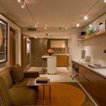 Apartments,Impressive Small Space Apartment Ideas With Stylish Open Plan Kitchen And Comfortable Brown Sofa Plus Beautiful Tv Wall Units Also Splendid Wall Hanging Bookshelf,Comfort Studio For Contemporary Apartment Ideas