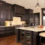 Furniture,Astounding Beautiful Contemporary Kitchen Design Ideas With Style Large Black Wood Kitchen Cabinet And Cool Kitchen Island In Black White Color Also Comfortable Cream Padded Wood Bar Stools Plus Antique Three Glass Pendant Lamp,Beautiful Contemporary Kitchens