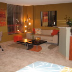 Apartments,Fascinating Beige Wall Paint Studio Apartment Interior Design Inspiration With Wonderful Cream Leather Two Seater Sofa And Beautiful Black Coffe Table Plus Cozy Study Space Also Modern Chrome Floor Lamp,Extraordinary Studio Apartment Interior Designs