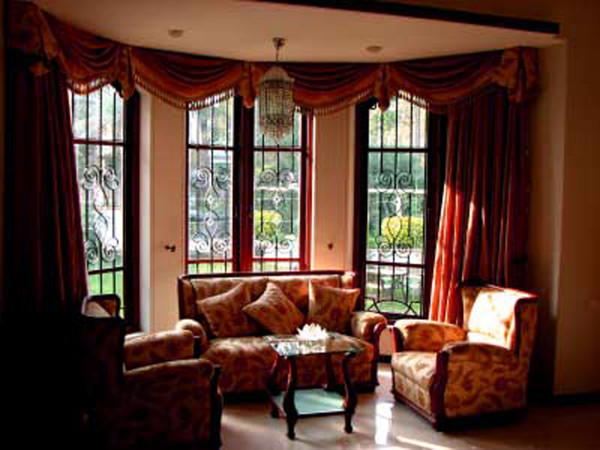 Interior,Enticing White Background Window Curtain Design Ideas With Beautiful Dark Red Curtains And Comfortable White Floral Pattern Sofas Also Cool Glass Square Table For Traditional Concept,Window Curtain Design Ideas Looks Beautiful In The House